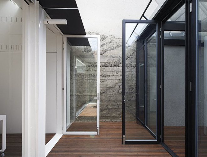 green house, Sean Godsell Architects, melbourne, australia, green renovation, automated sunscreen, aluminum screens, metal screens, aluminium, timber cottage, natural light , skylights, cathedral ceiling, inner courtyard