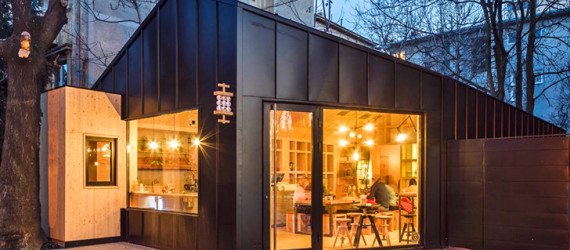 Frudisiac, Bucharest, metal clad cabin, cafe in a cabin, Not a Number Architects, contemporary cafe, spruce panels, spruce, natural light, skylights,