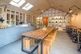 Frudisiac, Bucharest, metal clad cabin, cafe in a cabin, Not a Number Architects, contemporary cafe, spruce panels, spruce, natural light, skylights,