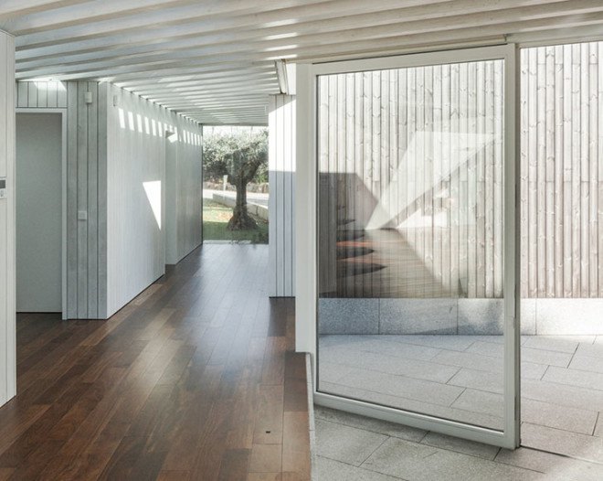 PROD Arquitectura, Portugal, House of Four Houses, green architecture, pitched roof, vernacular architecture, natural light, mezzanine, deck terrace, mobile partitions, glass-to-ceiling windows