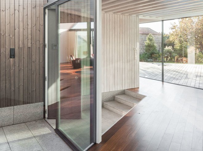PROD Arquitectura, Portugal, House of Four Houses, green architecture, pitched roof, vernacular architecture, natural light, mezzanine, deck terrace, mobile partitions, glass-to-ceiling windows