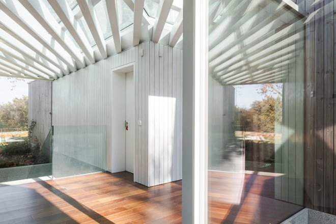 PROD Arquitectura, Portugal, House of Four Houses, green architecture, pitched roof, vernacular architecture, natural light, mezzanine, deck terrace, mobile partitions, glass-to-ceiling windows