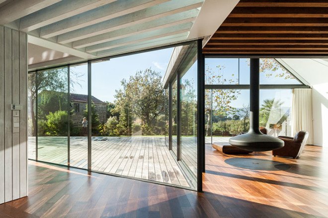 PROD Arquitectura, Portugal, House of Four Houses, green architecture, pitched roof, vernacular architecture, natural light, mezzanine, deck terrace, mobile partitions, glass-to-ceiling windows