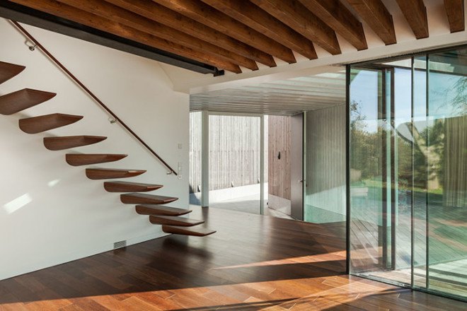 PROD Arquitectura, Portugal, House of Four Houses, green architecture, pitched roof, vernacular architecture, natural light, mezzanine, deck terrace, mobile partitions, glass-to-ceiling windows