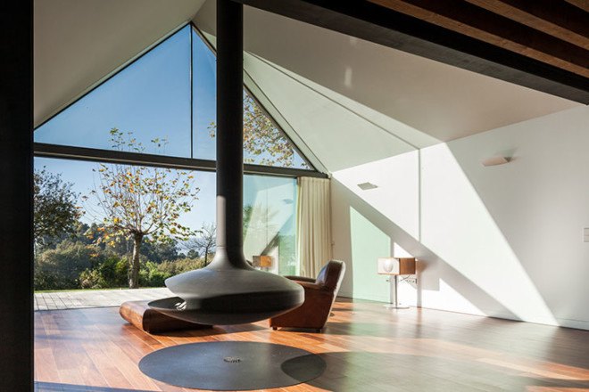 PROD Arquitectura, Portugal, House of Four Houses, green architecture, pitched roof, vernacular architecture, natural light, mezzanine, deck terrace, mobile partitions, glass-to-ceiling windows