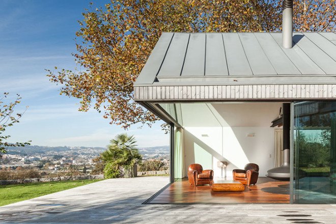 PROD Arquitectura, Portugal, House of Four Houses, green architecture, pitched roof, vernacular architecture, natural light, mezzanine, deck terrace, mobile partitions, glass-to-ceiling windows