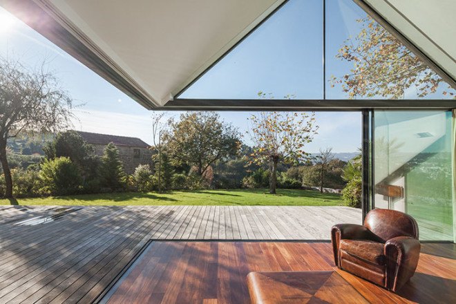 PROD Arquitectura, Portugal, House of Four Houses, green architecture, pitched roof, vernacular architecture, natural light, mezzanine, deck terrace, mobile partitions, glass-to-ceiling windows