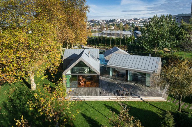 PROD Arquitectura, Portugal, House of Four Houses, green architecture, pitched roof, vernacular architecture, natural light, mezzanine, deck terrace, mobile partitions, glass-to-ceiling windows