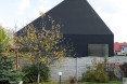 House in Lubliniec 2, Dyrda Fikus Architekci, sculptural architecture, dark exterior, polyurethane facade, residential architecture, family home, skylights, daylit house