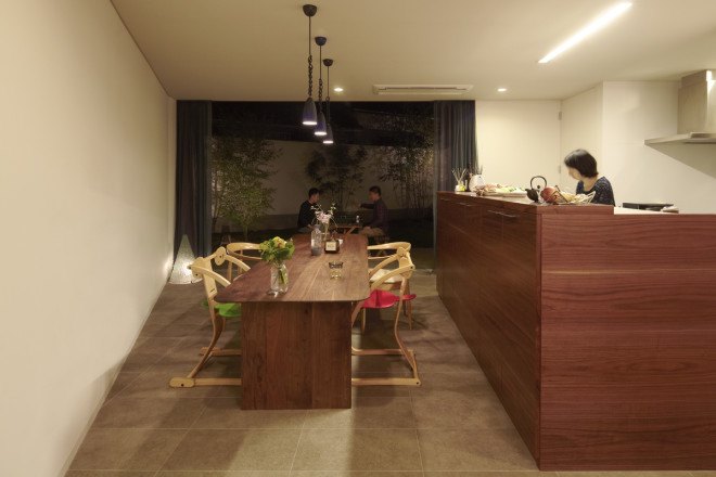 N House, N House by Roote, Roote, difficult terrain, difficult site, challenging plot of land, challenging site, timber clad architecture, timber, floor to ceiling glass doors, outdoor patio, children’s play space, Fukuoka, Japanese architecture,