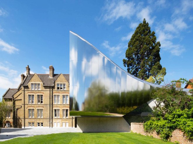 Zaha Hadid, Oxford, steel facade, reflective facade, stainless steel, Zaha Hadid Architects, reading room design, oak veneer, acoustic performance, green building, UK architecture, university campus