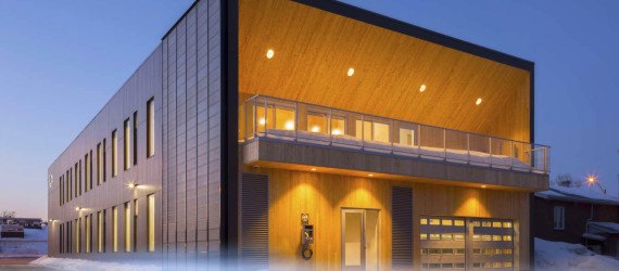 STGM Architects, headquarters, Quebec, Canada, office space, natural lighting, water management, energy-efficient building, wooden facade, timber facade, solar wall, green architecture, prefab building, open-plan office, LED lights