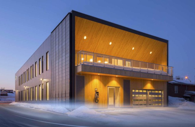 STGM Architects, headquarters, Quebec, Canada, office space, natural lighting, water management, energy-efficient building, wooden facade, timber facade, solar wall, green architecture, prefab building, open-plan office, LED lights