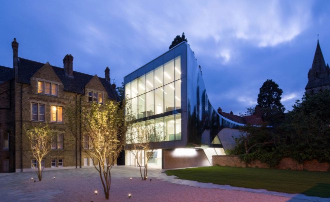 Zaha Hadid, Oxford, steel facade, reflective facade, stainless steel, Zaha Hadid Architects, reading room design, oak veneer, acoustic performance, green building, UK architecture, university campus
