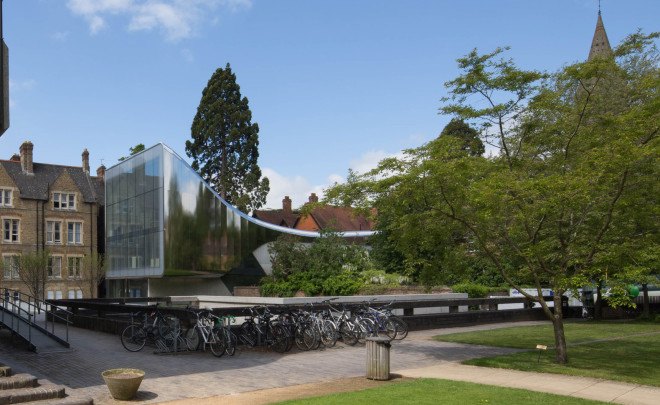 Zaha Hadid, Oxford, steel facade, reflective facade, stainless steel, Zaha Hadid Architects, reading room design, oak veneer, acoustic performance, green building, UK architecture, university campus
