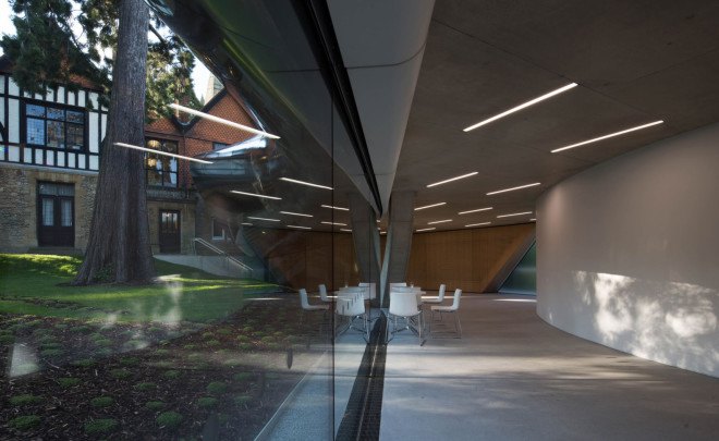 Zaha Hadid, Oxford, steel facade, reflective facade, stainless steel, Zaha Hadid Architects, reading room design, oak veneer, acoustic performance, green building, UK architecture, university campus