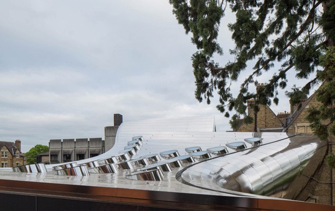 Zaha Hadid, Oxford, steel facade, reflective facade, stainless steel, Zaha Hadid Architects, reading room design, oak veneer, acoustic performance, green building, UK architecture, university campus