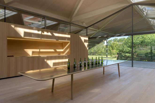 Foster + Partners, Château Margaux winery, winery, France, green renovation, natural light, pitched roof, vernacular architecture, green architecture, wine cellar