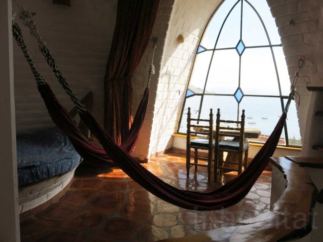 Martin Stratker, Las Olas, fairy tale accomodation, Bolivian hotel, Copacabana, Bolivia, local builders, German sculptor, animal shaped building, snail building, Ana Lisa Alperovich