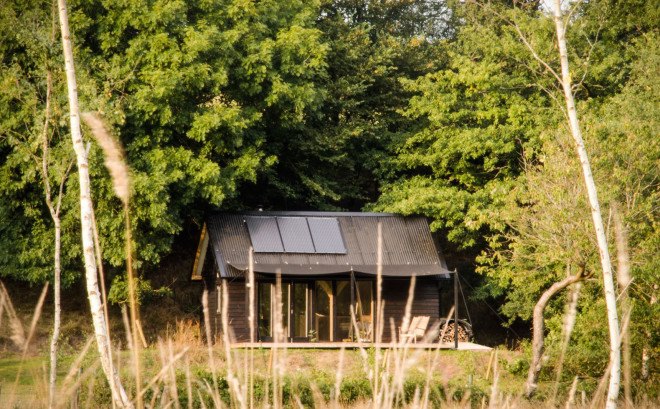 composting toilet, Out of the Valley cabin, Shou Sugi Ban, charred timber, corrugated roof, National Trust woodland, River Teign, handcrafted furniture, solar panels, solar powered cabin, off grid cabin, Rupert McKelvie