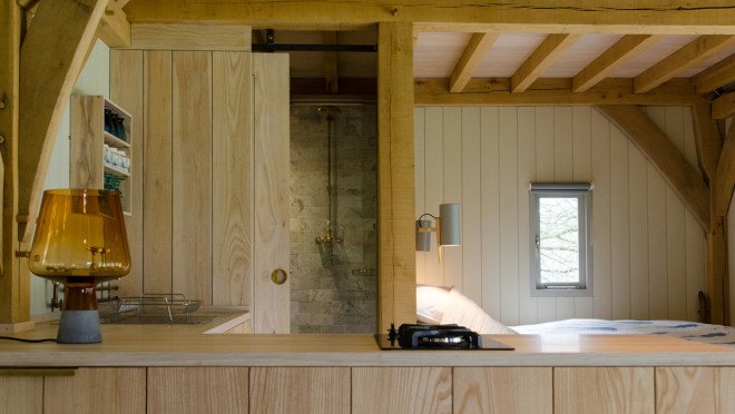 composting toilet, Out of the Valley cabin, Shou Sugi Ban, charred timber, corrugated roof, National Trust woodland, River Teign, handcrafted furniture, solar panels, solar powered cabin, off grid cabin, Rupert McKelvie