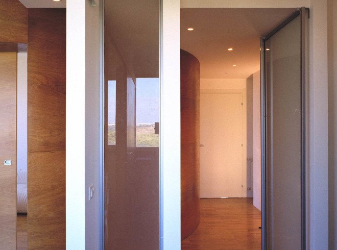 Officina Leonardo, Rome, Italy, green renovation, apartment transformation, wood siding, wood cladding, sliding doors, natural light, twin flats, mosaic floors, parquet floor