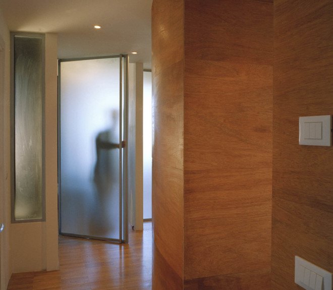 Officina Leonardo, Rome, Italy, green renovation, apartment transformation, wood siding, wood cladding, sliding doors, natural light, twin flats, mosaic floors, parquet floor