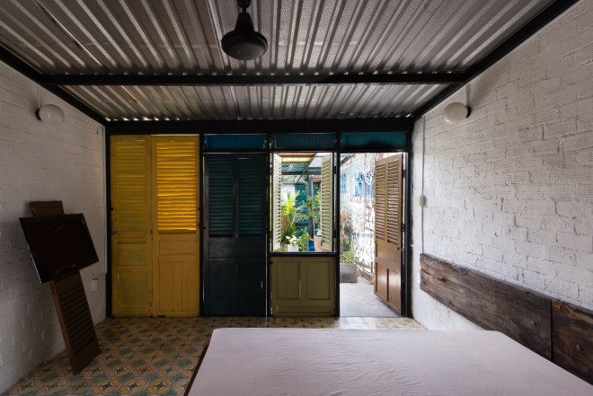 block architects, vegan house, vietnam architecture, shutter house, colorful shutters, quang tran photography, tube houses, jalousie windows, daylighting
