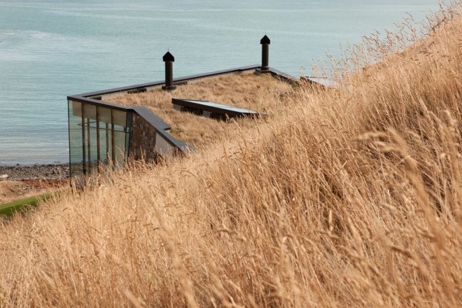 Annandale Seascape Cottage, Pattersons, New Zealand, green retreat, green cottage, rainwater harvesting, reforestation, earthquake-resistant home, glass facade, seaside home