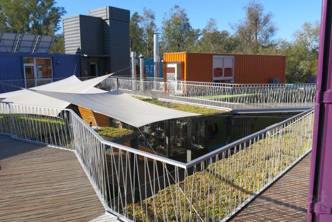 BZZ Arquitectura, shipping container mall, QUO Container Center, Cecilia Bertezzolo, EcoSan, Ingeniero Maschwitz, colorful containers, sustaimable shopping center, Buenos Aires, stacked shipping containers