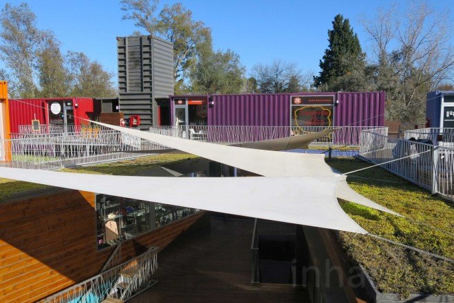 BZZ Arquitectura, shipping container mall, QUO Container Center, Cecilia Bertezzolo, EcoSan, Ingeniero Maschwitz, colorful containers, sustaimable shopping center, Buenos Aires, stacked shipping containers