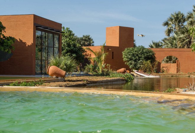 atelier koe, khamsa, senegal, clay bricks, harvested raw materials, raw building materials, solar power, wind power, wind turbine, natural pool, natural filtration system, natural freshwater pool, natural swimming pool