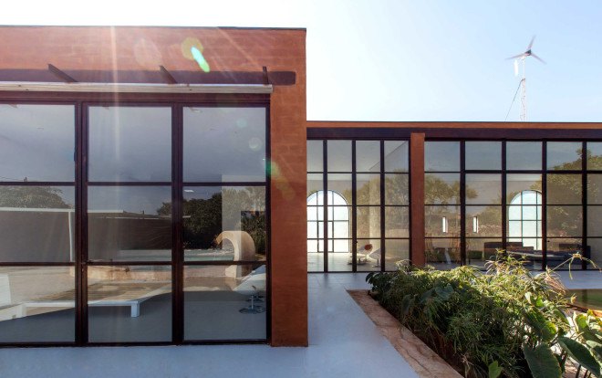 atelier koe, khamsa, senegal, clay bricks, harvested raw materials, raw building materials, solar power, wind power, wind turbine, natural pool, natural filtration system, natural freshwater pool, natural swimming pool