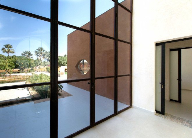 atelier koe, khamsa, senegal, clay bricks, harvested raw materials, raw building materials, solar power, wind power, wind turbine, natural pool, natural filtration system, natural freshwater pool, natural swimming pool