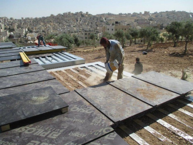 Cameron Sinclair, Pilosio, Pilosio Building Peace, Re:build, re:build construction system, solar panels, solar power, refugee camps, syrian refugees, syrian refugee architecture, syrian refugee camp, syrian refugee school, syrian refugee buildings, scaffolding tubes, phenolic film, plywood, rainwater collection, modular architecture, locally sourced materials, sustainable refugee architecture, Pouya Khazaeli