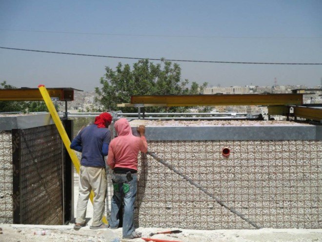 Cameron Sinclair, Pilosio, Pilosio Building Peace, Re:build, re:build construction system, solar panels, solar power, refugee camps, syrian refugees, syrian refugee architecture, syrian refugee camp, syrian refugee school, syrian refugee buildings, scaffolding tubes, phenolic film, plywood, rainwater collection, modular architecture, locally sourced materials, sustainable refugee architecture, Pouya Khazaeli