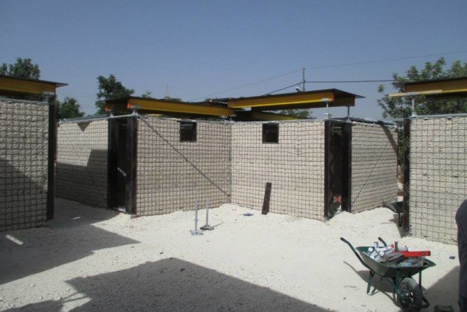 Cameron Sinclair, Pilosio, Pilosio Building Peace, Re:build, re:build construction system, solar panels, solar power, refugee camps, syrian refugees, syrian refugee architecture, syrian refugee camp, syrian refugee school, syrian refugee buildings, scaffolding tubes, phenolic film, plywood, rainwater collection, modular architecture, locally sourced materials, sustainable refugee architecture, Pouya Khazaeli