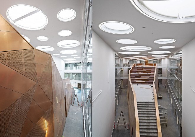 C.F. Møller, University of Southern Denmark, Odense, atrium, natural ventilation, solar screen, glare protection, compact reinforced composite concrete, CRC concrete, prefab panels, Technical Facility University of Southern Denmark