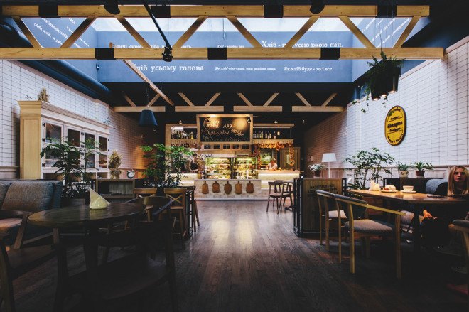 YØDEZEEN, bakery, interior design, green interior, green lighting, Roderick Vos, furniture design, hanging planters, hanging plants, wooden interior, green design