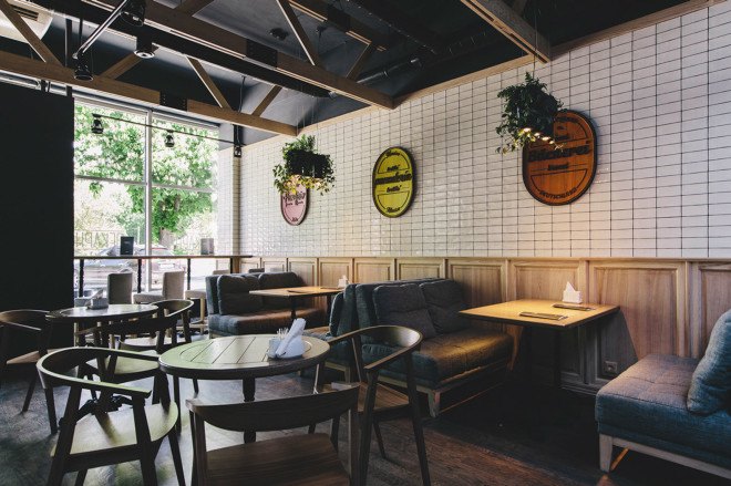 YØDEZEEN, bakery, interior design, green interior, green lighting, Roderick Vos, furniture design, hanging planters, hanging plants, wooden interior, green design
