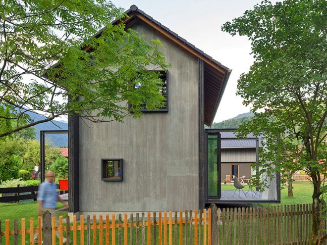 Holzhaus am Auerbach, Holzhaus am Auerbach by Christine Arnhard and Markus Eck, Christine Arnhard and Markus Eck, holiday home, alpine retreat, Urlaubs Architektur, Upper Bavaria, Germany, Upper Bavaria architecture, overhanging eaves, pitched roof, black stained timber, patina, split levels, Auerbach, cantilever,