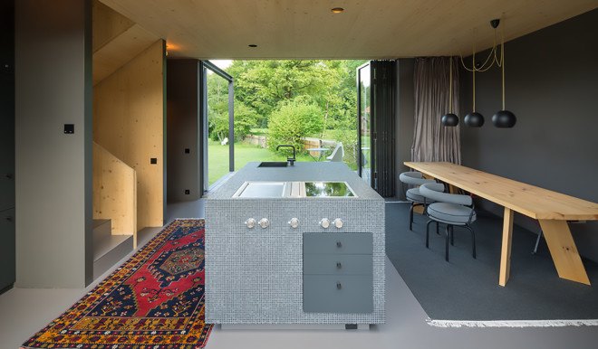 Holzhaus am Auerbach, Holzhaus am Auerbach by Christine Arnhard and Markus Eck, Christine Arnhard and Markus Eck, holiday home, alpine retreat, Urlaubs Architektur, Upper Bavaria, Germany, Upper Bavaria architecture, overhanging eaves, pitched roof, black stained timber, patina, split levels, Auerbach, cantilever,
