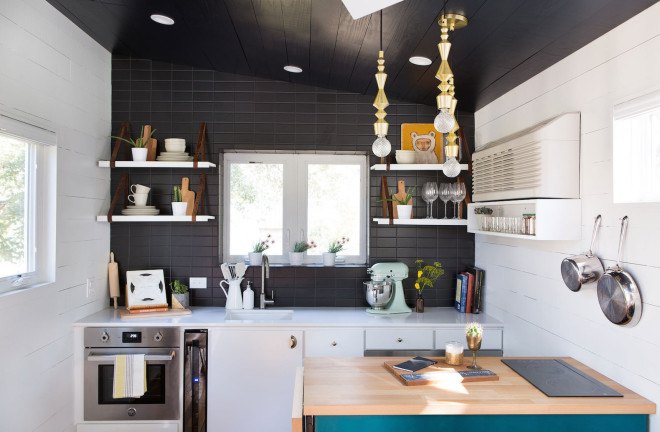 Austin, Kim Lewis, midcentury, bohemian design, tiny home, tiny house, tiny mobile home, mobile home, breezeway, Parasoleil, perforated copper, repurposed wood, salvaged wood, two mobile trailer home, tiny Austin home