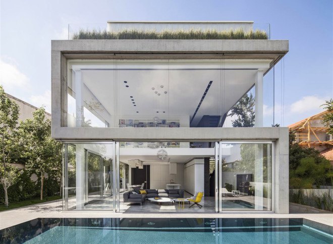 Concrete Cut House, Tel-Aviv, Israel, Pitsou Kedem Architects, concrete, daylit spaces, glass facade, chandelier, swimming pool, family home