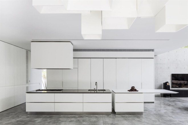Concrete Cut House, Tel-Aviv, Israel, Pitsou Kedem Architects, concrete, daylit spaces, glass facade, chandelier, swimming pool, family home