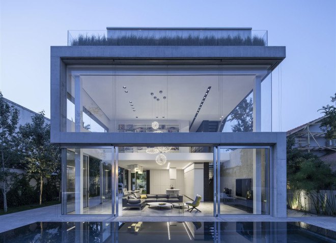 Concrete Cut House, Tel-Aviv, Israel, Pitsou Kedem Architects, concrete, daylit spaces, glass facade, chandelier, swimming pool, family home