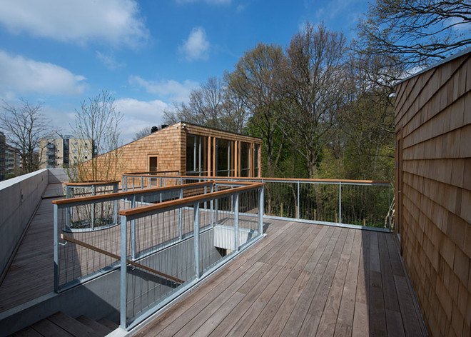 Copenhagen, Sophus Søbye Arkitekter, multipurpose space, multiuse space, shingles, pitched roof, concrete architecture, meeting place, community center, green architecture, timber structure, courtyard