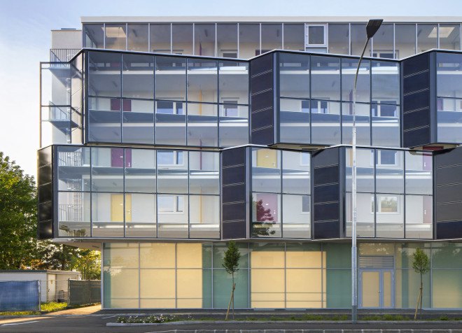 Glanhof housing, glass facade, multifamily housing, social housing, Austria, Architects Collective, solar design, solar panels, heat pump, geothermal, solar power, green architecture