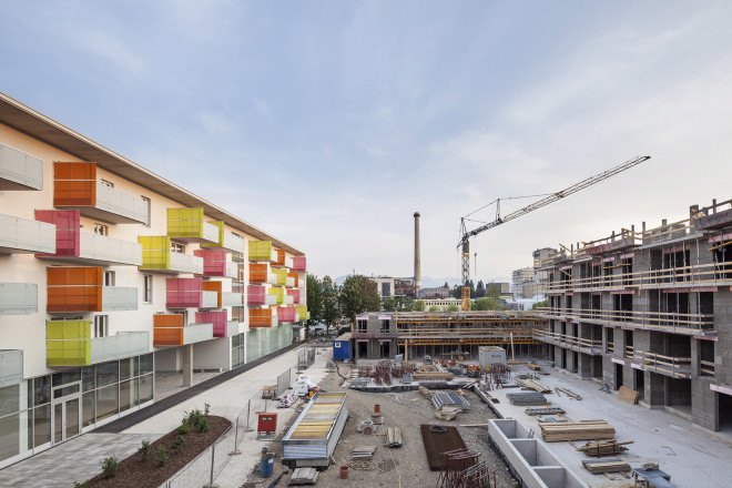 Glanhof housing, glass facade, multifamily housing, social housing, Austria, Architects Collective, solar design, solar panels, heat pump, geothermal, solar power, green architecture