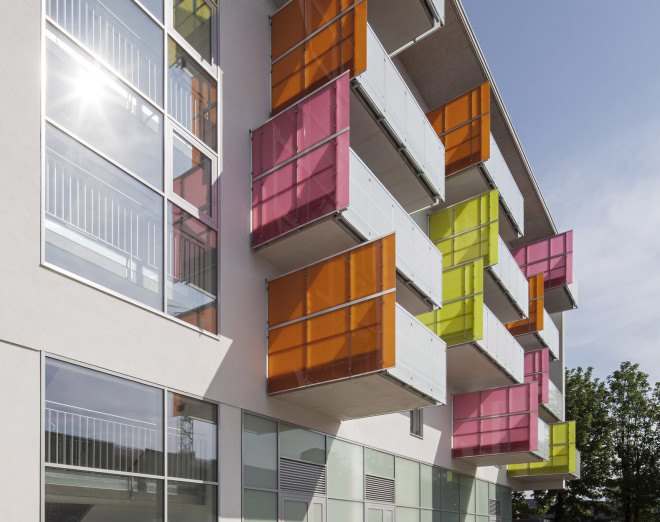 Glanhof housing, glass facade, multifamily housing, social housing, Austria, Architects Collective, solar design, solar panels, heat pump, geothermal, solar power, green architecture